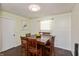 A dining room with a wooden table, chairs, hardwood floors, and natural light at 2170 N Old State Road 9, Columbus, IN 47203