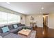 Cozy living room features a large sectional sofa, natural light, and stylish decor accents at 2170 N Old State Road 9, Columbus, IN 47203