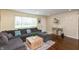 Comfortable living room with a large sectional sofa, wood floors, and bright natural light at 2170 N Old State Road 9, Columbus, IN 47203