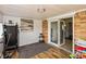 A sun room with hardwood floors, a treadmill, and access to the backyard at 2170 N Old State Road 9, Columbus, IN 47203