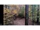 A captivating view of the backyard, adorned with the vibrant colors of autumn at 2246 E Yellowwood Ln, Martinsville, IN 46151