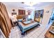 Large bedroom with wood-style bed, white tile floor, ceiling fan, and closet at 2246 E Yellowwood Ln, Martinsville, IN 46151