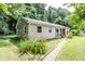 Single story home featuring durable metal roofing, light colored siding, and fresh landscaping at 2246 E Yellowwood Ln, Martinsville, IN 46151