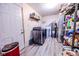 This is a utility/laundry room with washer/dryer, shelving, hot water heater and neutral paint at 2246 E Yellowwood Ln, Martinsville, IN 46151