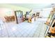 Open living room and dining area featuring tile flooring and natural light at 2246 E Yellowwood Ln, Martinsville, IN 46151