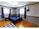 Comfortable bedroom featuring hardwood floors, neutral walls and window treatments at 227 Vestal Rd, Plainfield, IN 46168