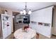 Inviting dining area featuring built-in cabinets and seamless flow to the cozy living space at 227 Vestal Rd, Plainfield, IN 46168