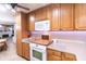 Kitchen featuring white appliances, plenty of cabinet space, and modern countertops at 227 Vestal Rd, Plainfield, IN 46168