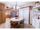 Cozy eat-in kitchen with a breakfast table, sliding glass doors, and stainless steel refrigerator at 227 Vestal Rd, Plainfield, IN 46168