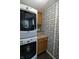 Efficient laundry room with modern appliances and decorative wallpaper at 227 Vestal Rd, Plainfield, IN 46168
