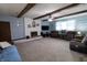 Spacious living room with a cozy fireplace, carpeted floors, and comfortable seating area at 227 Vestal Rd, Plainfield, IN 46168