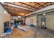 Unfinished basement with exposed beams and utilities offers potential for customization and additional living space at 253 W Westfield Blvd, Indianapolis, IN 46208