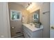 Bright bathroom with white vanity, ample storage, and natural light from the window at 253 W Westfield Blvd, Indianapolis, IN 46208