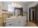 Vintage-style bathroom with vanity, mirror, unique tiling, and decorative fixtures at 253 W Westfield Blvd, Indianapolis, IN 46208