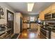 Well-equipped kitchen featuring hardwood floors, ample cabinet space, and modern appliances at 253 W Westfield Blvd, Indianapolis, IN 46208