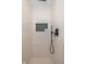 Elegant shower with stylish fixtures, tiled walls, and a convenient storage niche at 253 W Westfield Blvd, Indianapolis, IN 46208