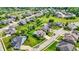 Expansive aerial view of a residential neighborhood with well-maintained lawns and various home styles at 2715 Benmore Ct, Zionsville, IN 46077