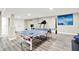 Basement recreation area featuring a ping pong table and fitness equipment for home workouts at 2715 Benmore Ct, Zionsville, IN 46077