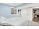 Cozy basement bedroom with natural light, closet and adjacent bonus living area at 2715 Benmore Ct, Zionsville, IN 46077