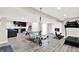 Open basement recreation space includes a ping pong table, workout equipment and wet bar at 2715 Benmore Ct, Zionsville, IN 46077