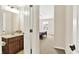 A bathroom with a granite vanity and view into the Primary bedroom at 2715 Benmore Ct, Zionsville, IN 46077