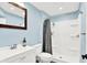 Well-lit bathroom with a white vanity, shower, and a framed mirror at 2715 Benmore Ct, Zionsville, IN 46077