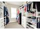 Walk-in closet with built-in shelves and hanging racks maximizes storage at 2715 Benmore Ct, Zionsville, IN 46077