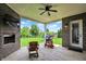 Relaxing covered patio with outdoor seating, perfect for enjoying the scenic backyard at 2715 Benmore Ct, Zionsville, IN 46077