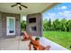Serene covered patio with brick fireplace overlooking a spacious, well-maintained lawn at 2715 Benmore Ct, Zionsville, IN 46077