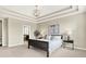 Elegant main bedroom with trey ceilings, a cozy bed, and soft lighting, creating a peaceful retreat at 2715 Benmore Ct, Zionsville, IN 46077