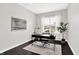 Cozy office space with a large window, minimalist decor, and hardwood floors at 2715 Benmore Ct, Zionsville, IN 46077