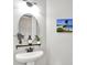 Charming powder room featuring a pedestal sink with elegant fixtures, complemented by tasteful decor and soft lighting at 2715 Benmore Ct, Zionsville, IN 46077