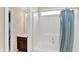 Well-lit walk-in shower features white enclosure and a blue shower curtain for privacy at 2715 Benmore Ct, Zionsville, IN 46077
