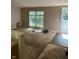Living room requiring repairs and renovation with outdated flooring and fixtures at 3042 S Conservation Club Rd, Morgantown, IN 46160