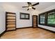 Clean bedroom with dark trim, wood floors, and natural light from several windows, creating a versatile space at 3246 N New Jersey St, Indianapolis, IN 46205