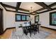 Elegant dining room with dark wood trim, a modern light fixture, and plenty of natural light for gatherings at 3246 N New Jersey St, Indianapolis, IN 46205