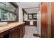 Charming kitchen with dark wood cabinetry, stainless steel appliances, and a cozy breakfast nook at 3246 N New Jersey St, Indianapolis, IN 46205