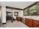 Kitchen boasts ample cabinetry, granite countertops, stainless appliances, and breakfast nook at 3246 N New Jersey St, Indianapolis, IN 46205
