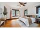 Inviting bedroom with hardwood floors, large windows, and a ceiling fan at 3246 N New Jersey St, Indianapolis, IN 46205