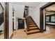 Classic staircase with wood detailing and hardwood floors, providing a seamless transition between levels at 3246 N New Jersey St, Indianapolis, IN 46205