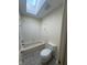 Bathroom showcasing a shower-tub combination and a skylight for natural light at 3350 Shore Dr, Greenwood, IN 46143