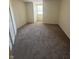 Comfortable bedroom features neutral carpet and a window providing ample natural light at 3350 Shore Dr, Greenwood, IN 46143