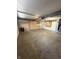Spacious garage with ample storage cabinets and concrete flooring at 3350 Shore Dr, Greenwood, IN 46143