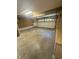 Open garage with a roll up door and utility cabinets at 3350 Shore Dr, Greenwood, IN 46143