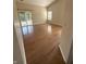 Bright living room with hardwood floors, large windows, and outdoor access at 3350 Shore Dr, Greenwood, IN 46143