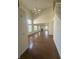 Expansive living room boasting hardwood floors, large windows, high ceilings, and a cozy fireplace at 3350 Shore Dr, Greenwood, IN 46143