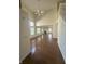 Expansive living room boasting hardwood floors, large windows, high ceilings, and a cozy fireplace at 3350 Shore Dr, Greenwood, IN 46143
