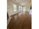 Bright living space with hardwood floors, a fireplace, and access to the outdoors, perfect for entertaining at 3350 Shore Dr, Greenwood, IN 46143