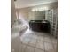 The main bathroom features double sinks, soaking tub, and glass block accents at 3350 Shore Dr, Greenwood, IN 46143