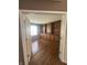 Spacious office with beautiful wood floors and a custom built-in bookshelf offering great storage space at 3350 Shore Dr, Greenwood, IN 46143